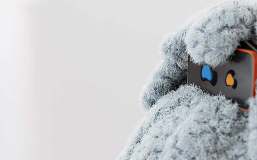 a photograph of a device placed on a soft textured surface