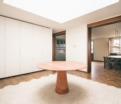 Oak and travertine flooring in this London apartment