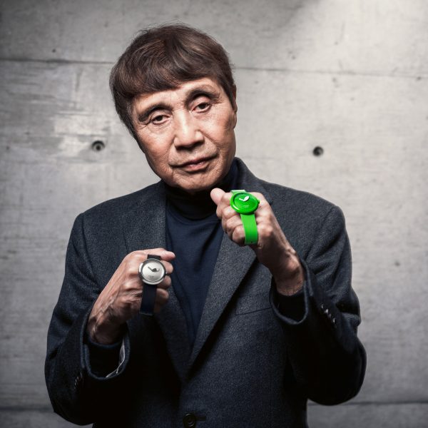 Japanese architect Tadao Ando holding two watches