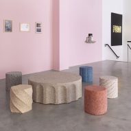 Photograph of four stools and the coffee table in the collection.