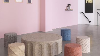 Photograph of four stools and the coffee table in the collection.
