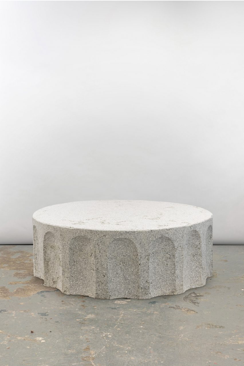 Photograph of the coffee table in the collection, which looks like a section of a classical granite column.