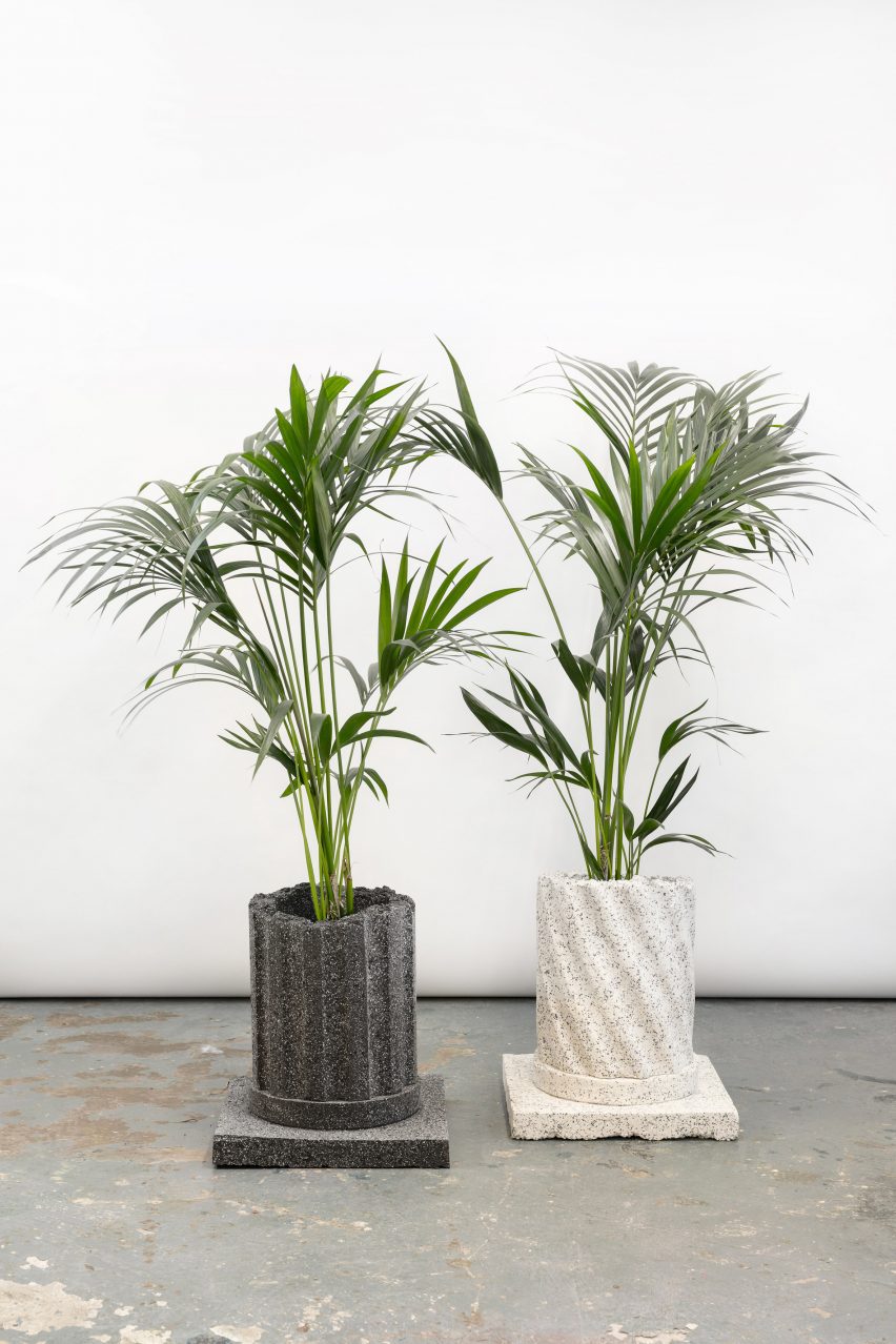 Photograph of two planters from the collection that resemble decaying granite columns.