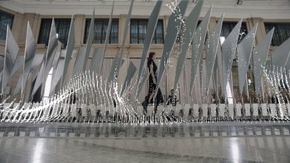A model walking down the installation