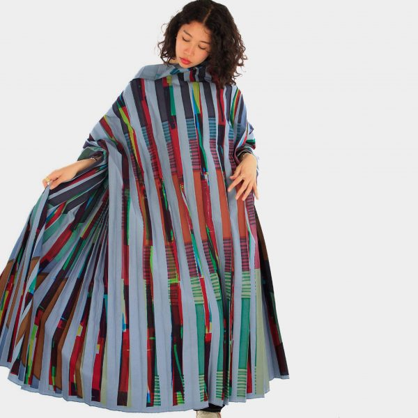 Student wearing her dress design inspired by her heritage