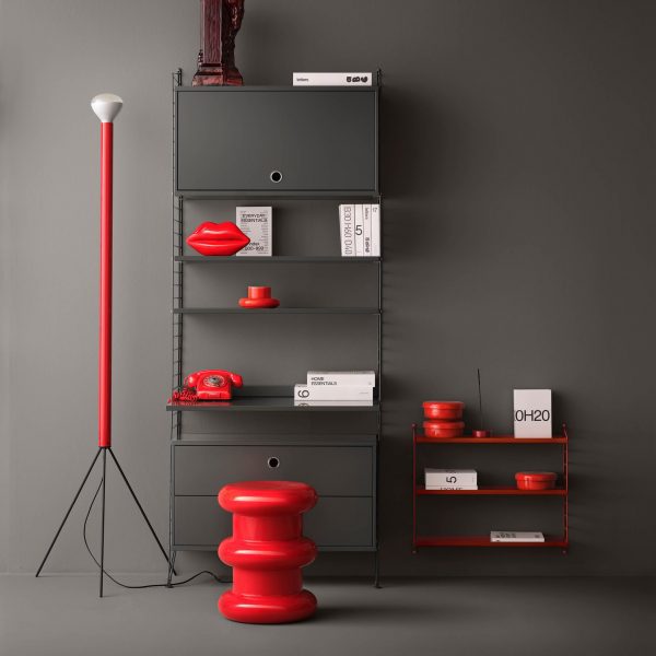 Photo of a grey with red furniture and accessories