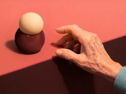 A graphic of hand reaching out for an egg