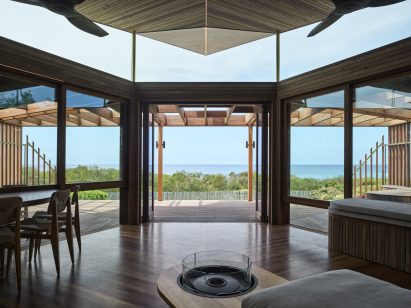 View towards the sea from within an updated home by Alexander Symes Architect