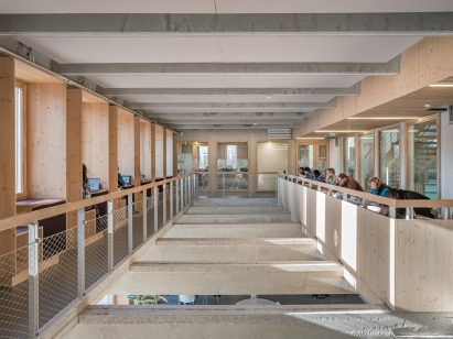 Timber and concrete media library by Associer