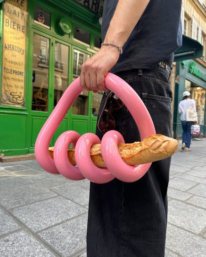 Glossy pink baguette holder by Gustaf Westman
