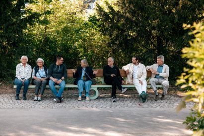 People balancing on bench