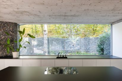 Kitchen interior of concrete home by Paulíny Hovorka Architects