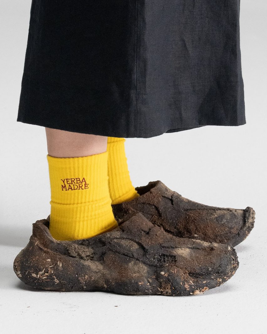 Person standing with shoes
