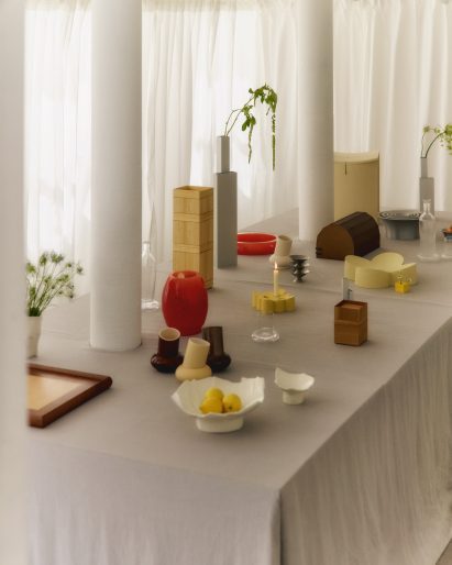 Design objects on table with white cloth