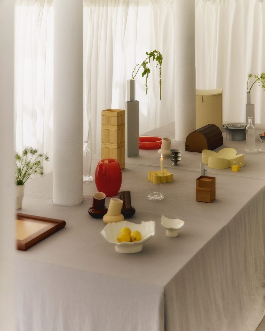 Design objects on table with white cloth