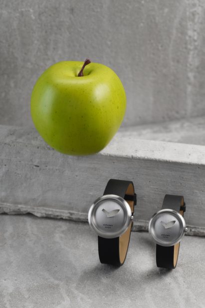 Two watches besides an apple