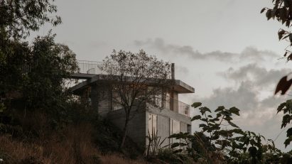 Concreet house at dusk in Colombian mountains