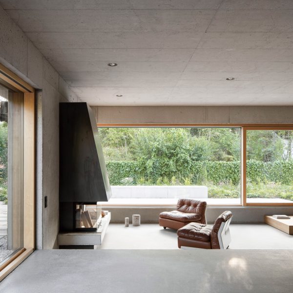 Living area within joined timber homes by Buero Wagner