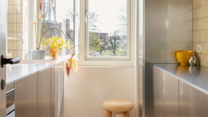 Galley kitchen with metal cabinets on either side