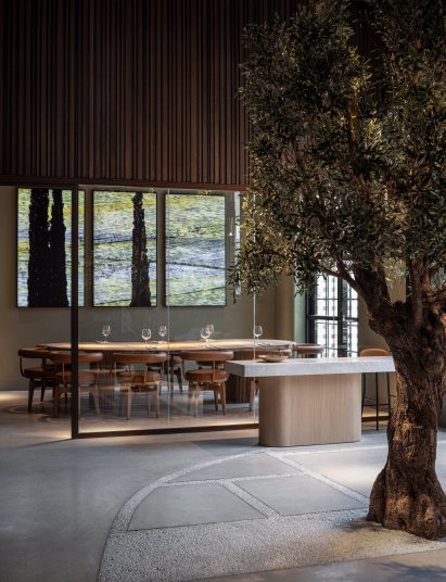 A "taxidermy" olive tree planted in front of private dining room