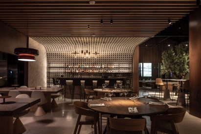 Blocks forming a curved feature wall behind a bar in a restaurant
