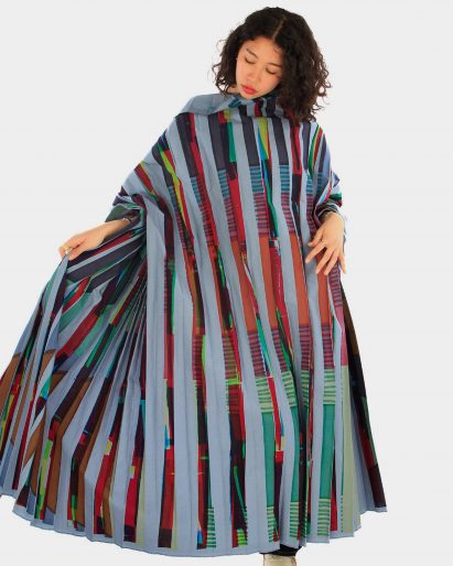 a photograph of a model wearing a garment in blue and red tones