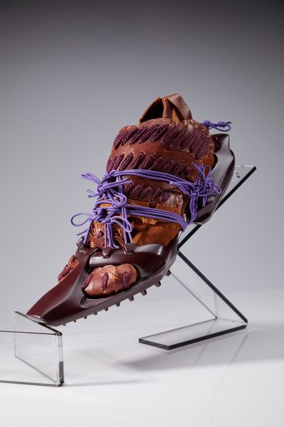 a photograph of a model of a shoe in tones of brown