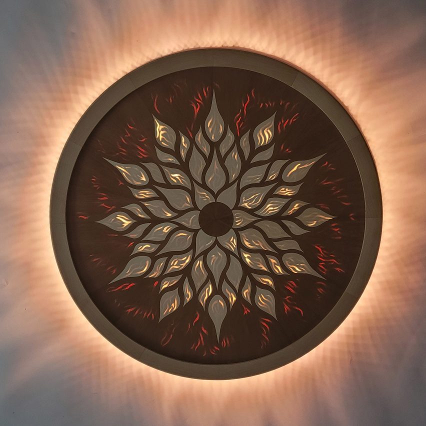 a photograph of a circular wall light in tones of brown