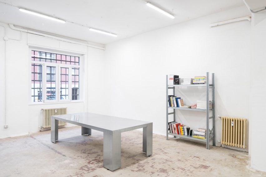 Steel table and shelf in Milan gallery