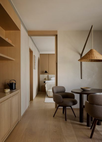 Living space and bedroom in Puro Warsaw guest room
