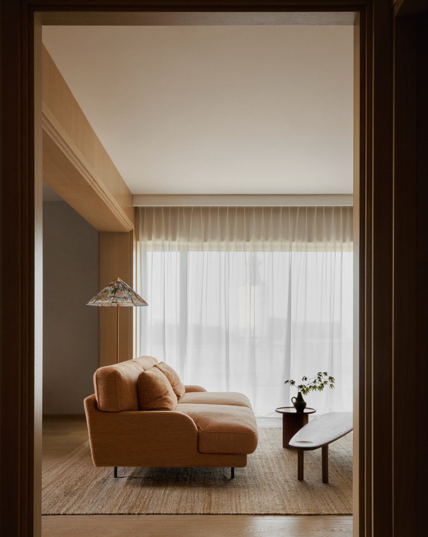Dusty orange sofa in Puro hotel Warsaw guest room