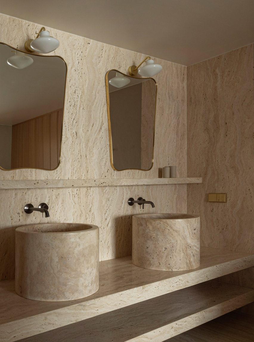 Twin travertine marble sinks and mirrors Puro hotel Warsaw
