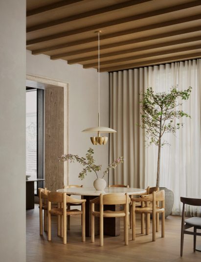 Circular table with wooden chairs and pendant light