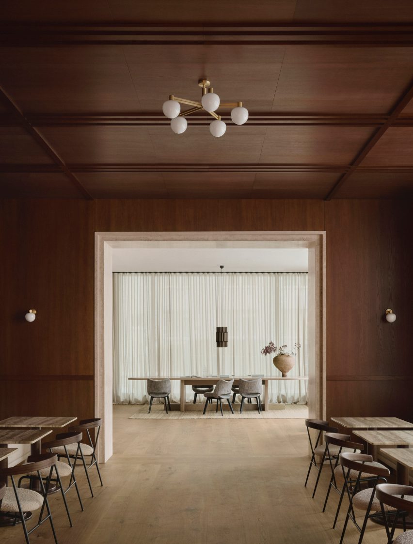 Wood-panelled walls and ceilings in room with large doorway