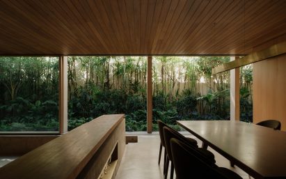 Dining area within concrete home by Gabriel Kogan and Guilherme Pianca