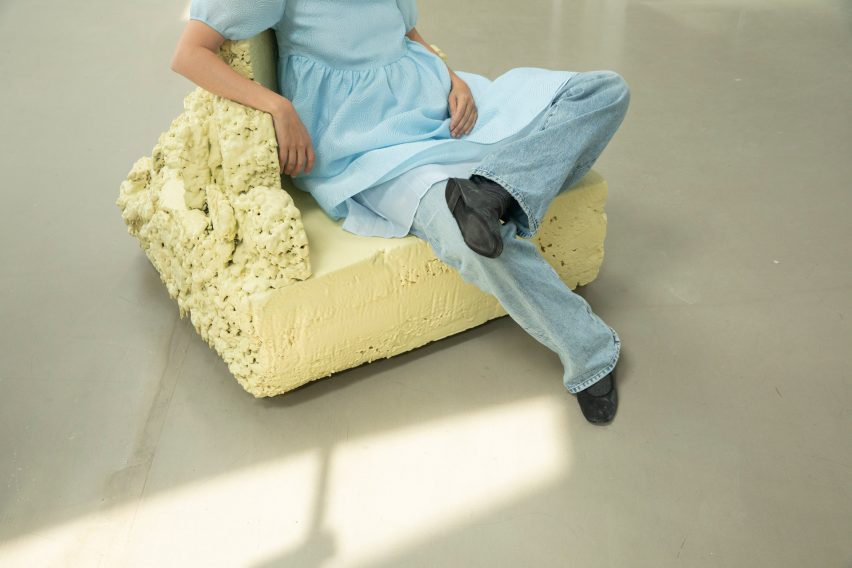 Woman sitting in yellow chair