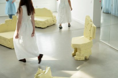 Women walking around chairs