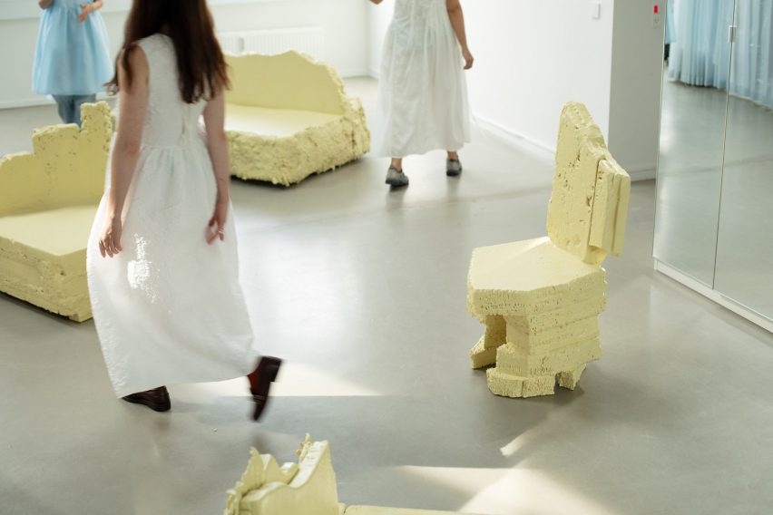 Women walking around chairs