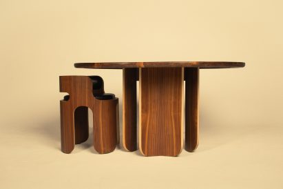 a photograph of a brown table and chair