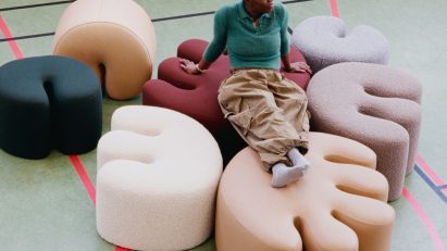 Kusheda Mensah sitting on Palma pouf for Hem