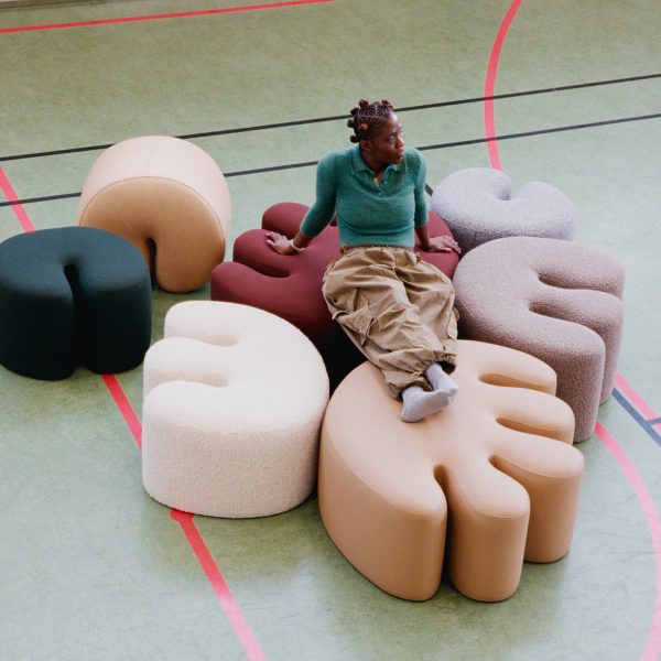 Kusheda Mensah sitting on Palma pouf for Hem