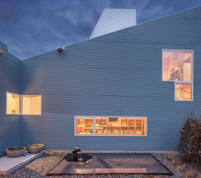 Blue facade of L-House in Hudson