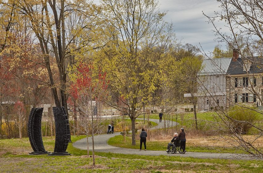 People being wheeled down a path