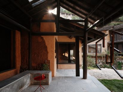 Rammed-earth house at art gallery by Team BLDG