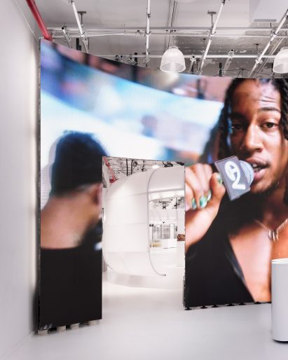 A doorway in a billboard-sized screen leads into the Telfar store