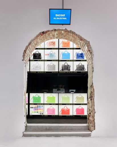 An archway punched through a brick wall forms an entrance to the "bag bar"