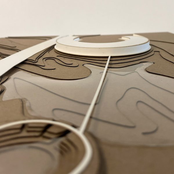 a photograph of an architectural model in tones of beige