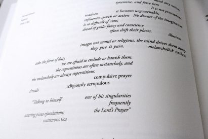 a photograph of a white book page with black text on it