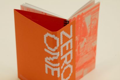 a photograph of an open book in orange and white tones