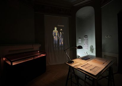 a photograph of an installation showing two people interacting